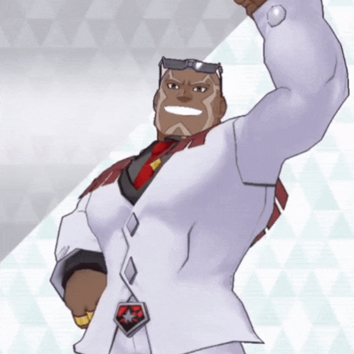 a man in a white suit and red tie holds his fist up