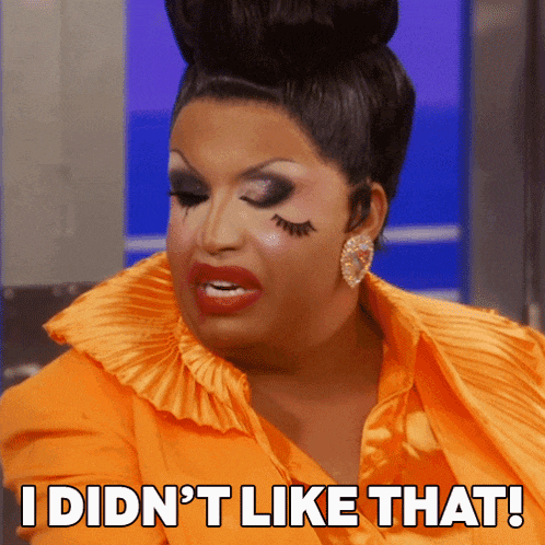 a drag queen says " i did n't like that " while wearing an orange dress