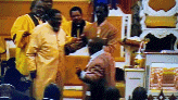 a group of men are standing around a podium in a church .