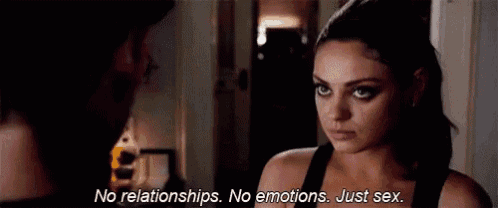 a woman is talking to a man in a dark room and saying `` no relationships , no emotions , just sex . ''