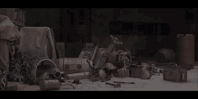 a bunch of junk is sitting on the ground in a dark room