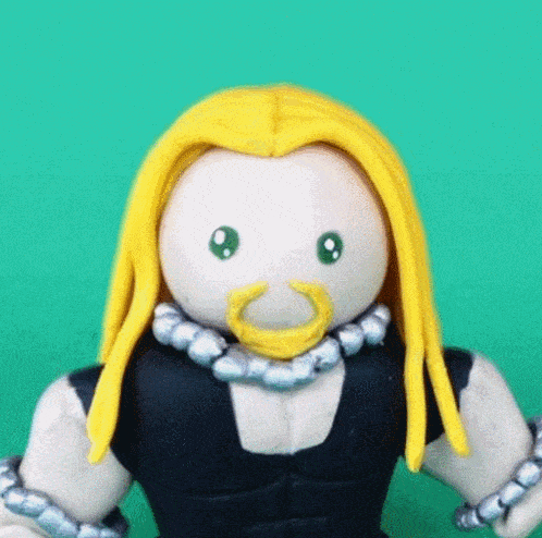 a figurine of a man with long blonde hair and a beard