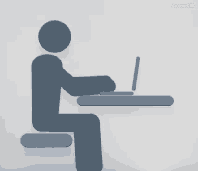 a silhouette of a person sitting at a desk with a laptop on it