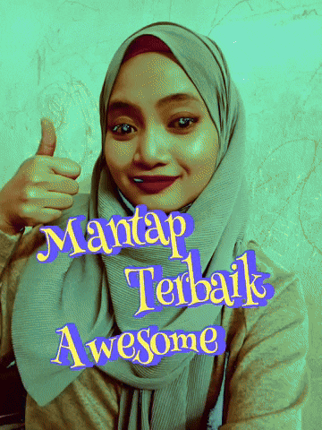 a woman wearing a hijab giving a thumbs up with mantap terbaik awesome written in yellow