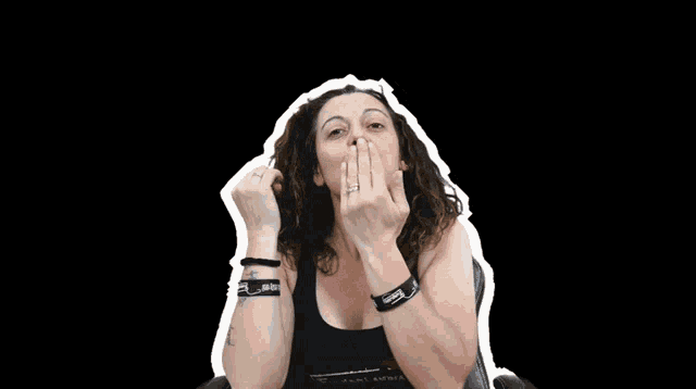 a woman with a tattoo on her wrist that says ' i love you '