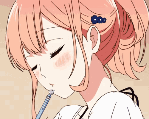 a girl with pink hair is drinking from a blue straw