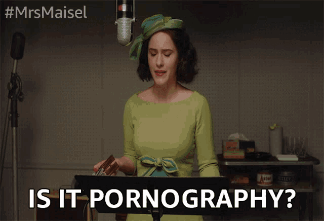 a woman in a green dress stands in front of a microphone with the words " is it pornography " above her