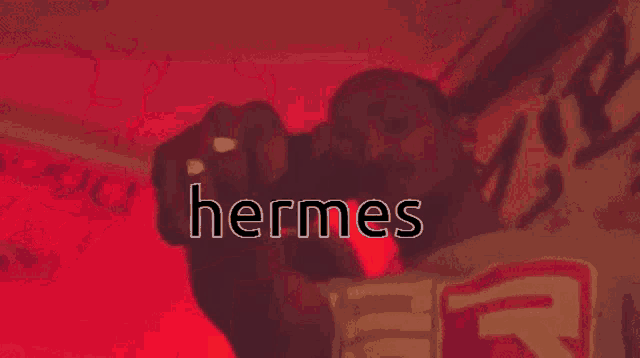 a red background with the word hermes written on it