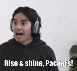 a man wearing headphones says rise & shine packers !