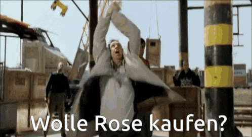 a man with his arms in the air with the words wolle rose kaufen written below him