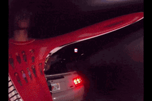 a person standing next to a car with a license plate that says ' nc '