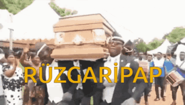 a group of men are carrying a coffin with the words ruzgaripap written on it