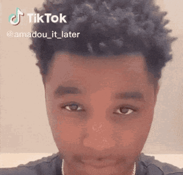 a close up of a man 's face with a tik tok watermark