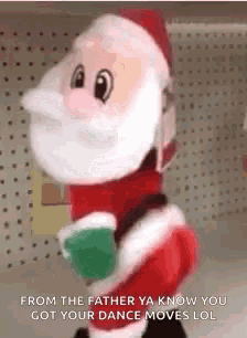 a stuffed santa claus is dancing and holding a cup of coffee in a store .