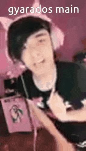 a blurry picture of a person wearing headphones with the words gyarados main written on the bottom .