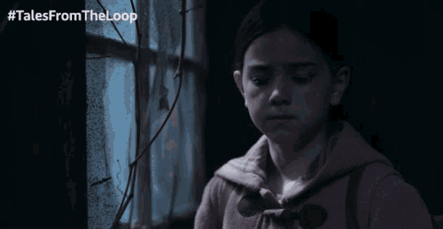 a girl looking out of a window with #talesfromtheloop written on the bottom