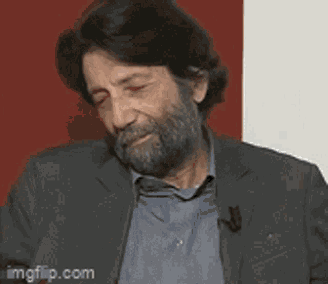 a man with a beard is making a funny face with the words ma ma ma