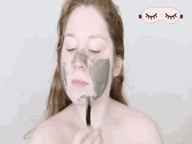 a woman with a clay mask on her face with the words treat yo ' self written in pink