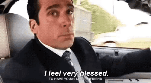 a man in a suit and tie is driving a car and saying `` i feel very blessed to have you as my best friend ''