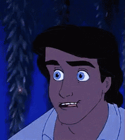a close up of a cartoon character with a surprised look on his face .