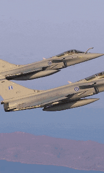 two fighter jets are flying side by side with one having the number 1 on the tail