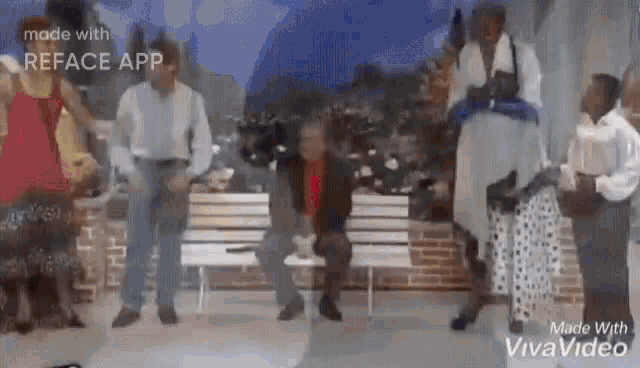 a group of people are standing around a bench in a park .