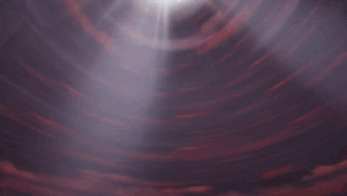 a person is flying through a tunnel with a light shining through it