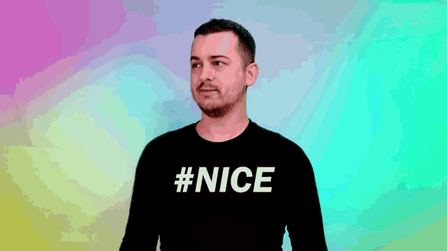 a man wearing a black shirt with #nice on it