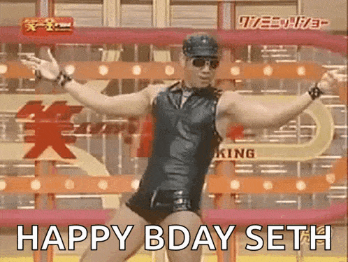a man in a leather outfit is dancing in front of a sign that says king .