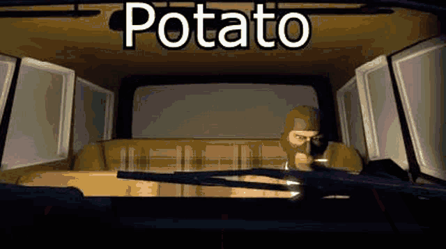 a man in a mask is sitting in the back seat of a car with the word potato above him .