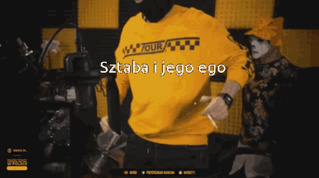 a man wearing a yellow shirt that says tour on it