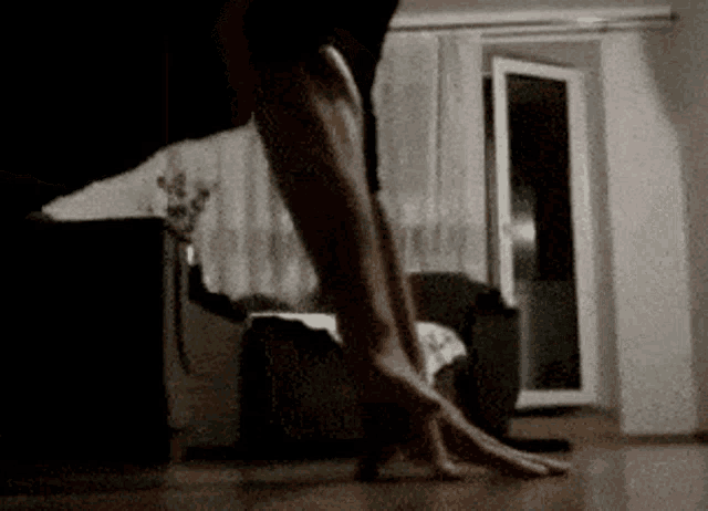 a person 's feet are shown in a living room