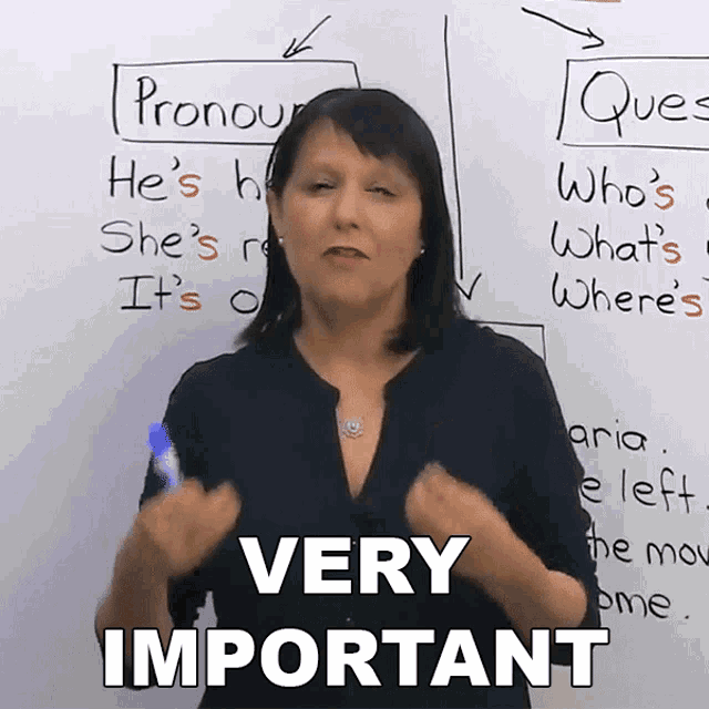 a woman stands in front of a white board with the words very important on it