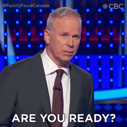 a man in a suit and tie asks are you ready