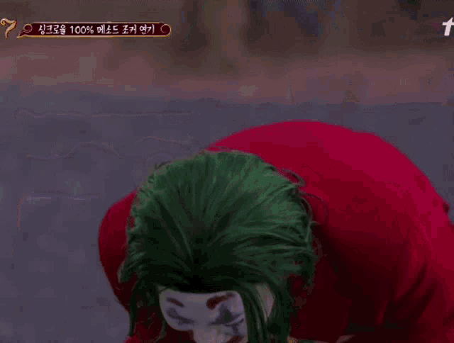 a man dressed as the joker with chinese writing on the bottom right