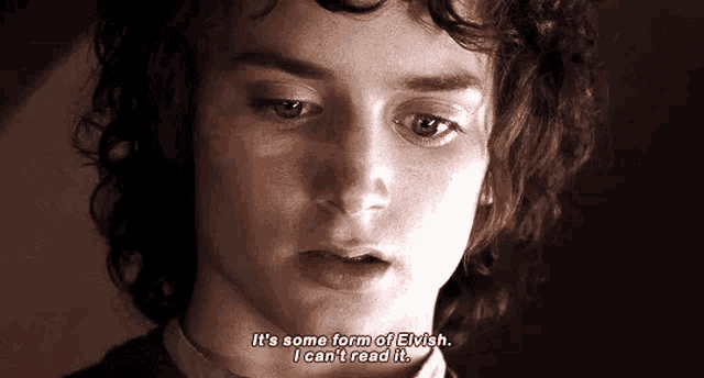 a man with curly hair says it 's some form of elvish .