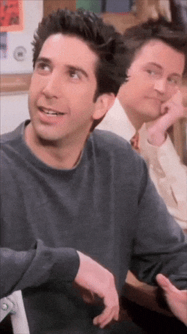 a close up of a man 's face with another man in the background