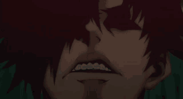 a close up of a person 's face with a slight smile