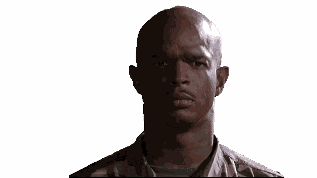 a man in a military uniform is looking at something
