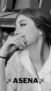 a black and white photo of a woman with the name asenax on the bottom right