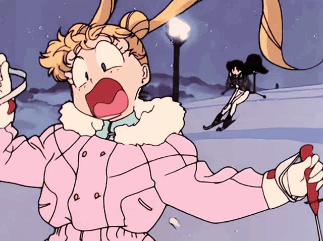 a girl in a pink coat is skiing down a snowy slope