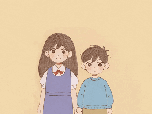 a boy and a girl standing next to each other