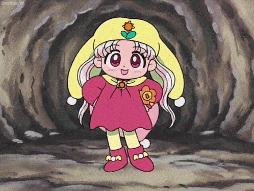 a little girl in a pink dress and yellow hat with a flower on it