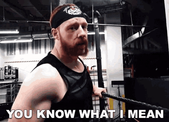 a man in a boxing ring with the words " you know what i mean " below him