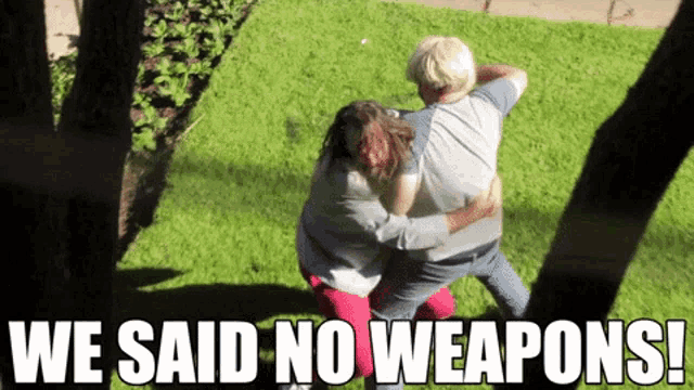 a man and a woman hugging with the words we said no weapons