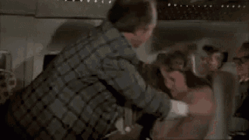 Airplane Movie GIF - Slapped Abused United Airlines GIFs