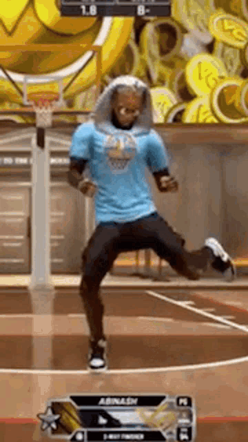 a man is playing a video game on a basketball court .