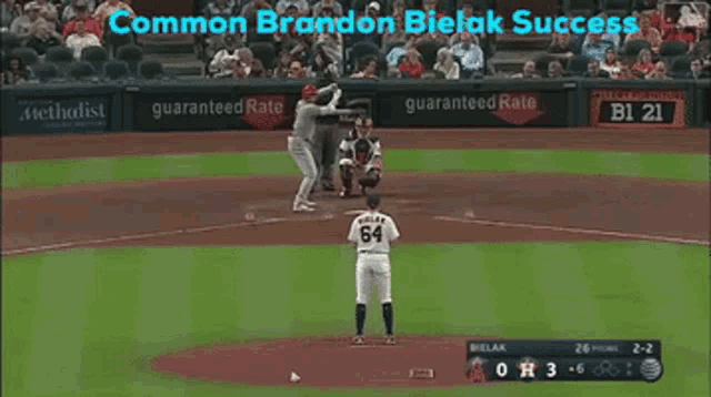 a baseball game is being played with a guaranteed rate banner on the outfield wall