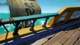 a boat with a sail that has a snake on it