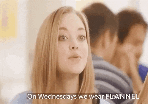 a woman is wearing a flannel on wednesdays